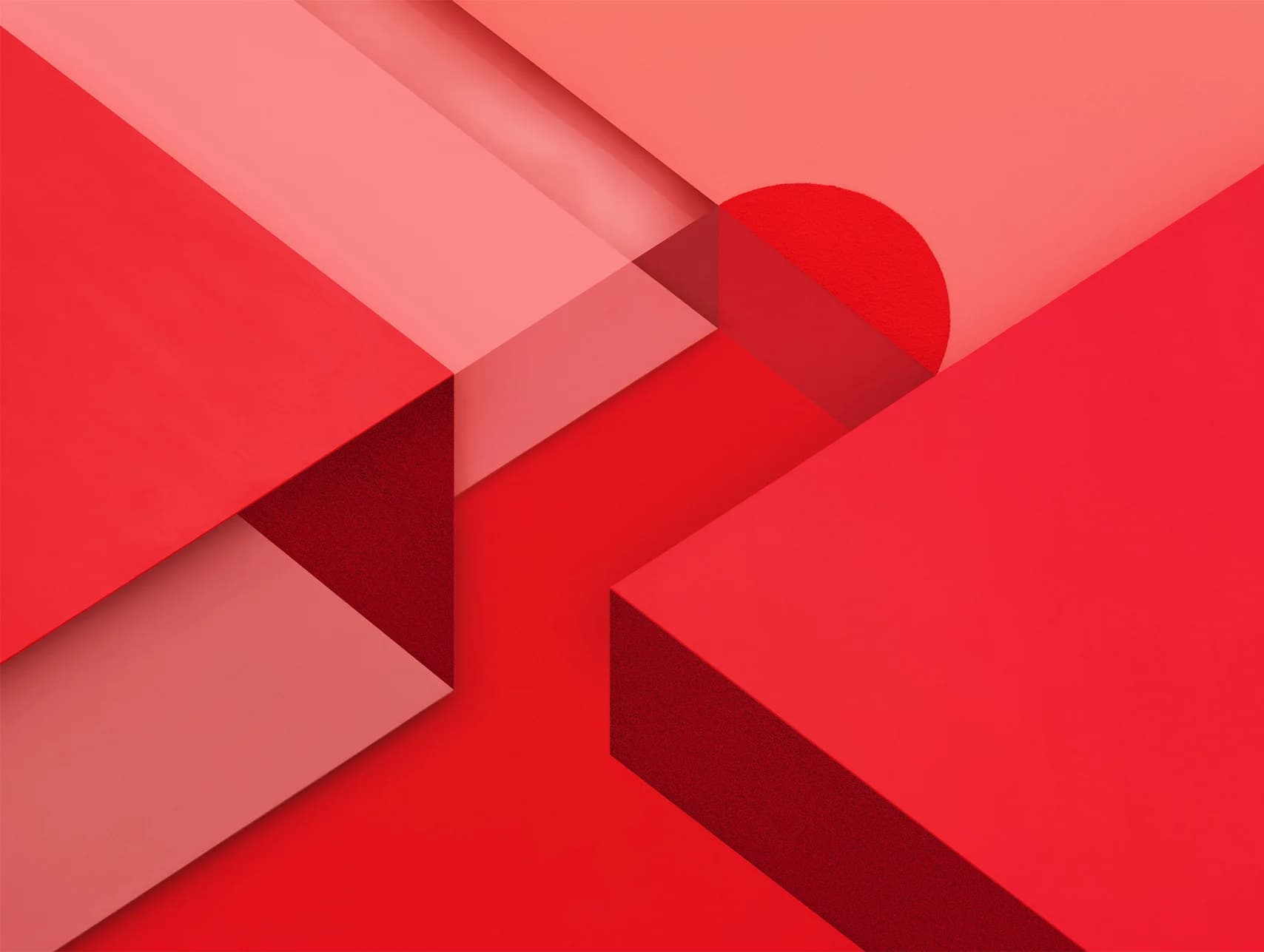 Geometric shapes in shades of red create an abstract composition. A partial red circle adds a focal point.