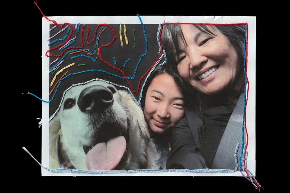 Close-up photo, bordered with colorful thread, of a woman, teen girl, and dog snuggling for a selfie. The dog's pink tongue is out.