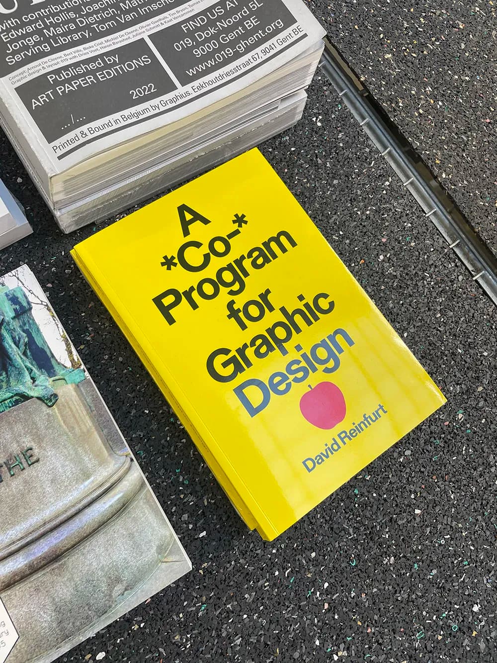 David Reinfurt’s book is displayed next to other printed materials.