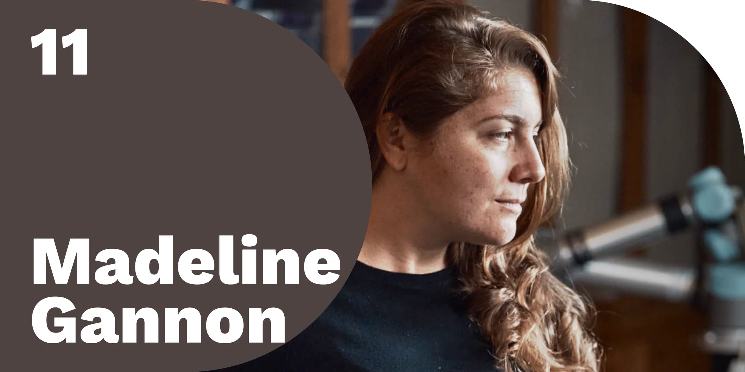 Madeline Gannon, innovator and robotics artist, pictured in profile view, appears contemplative. She's close to a partially blurred robotic arm.