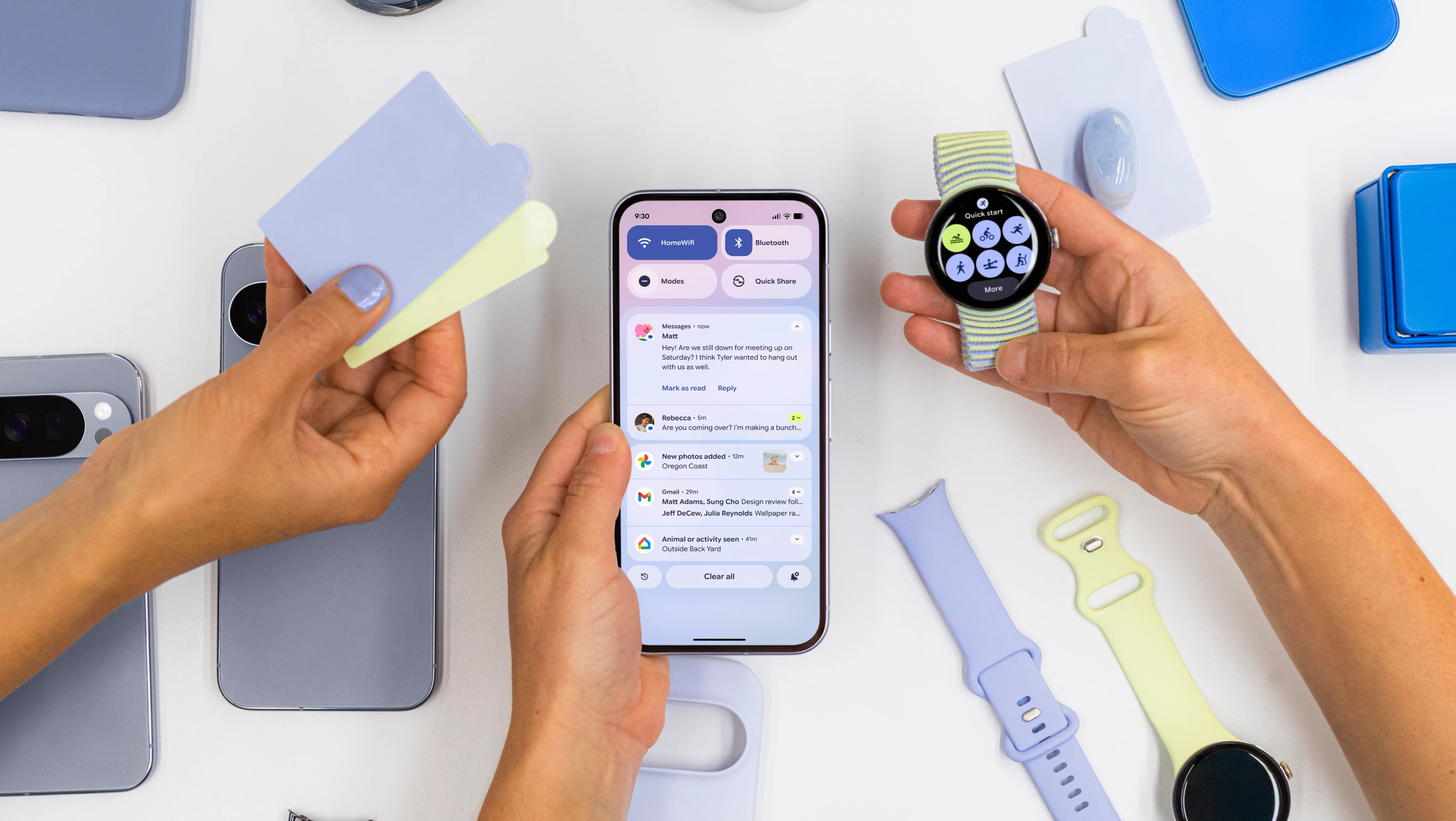Three hands hold color swatches, a smartphone, and a smartwatch side by side to compare colors.