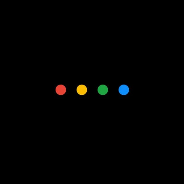 Four small circles in Google’s signature red, yellow, green, and blue aligned horizontally on a black background