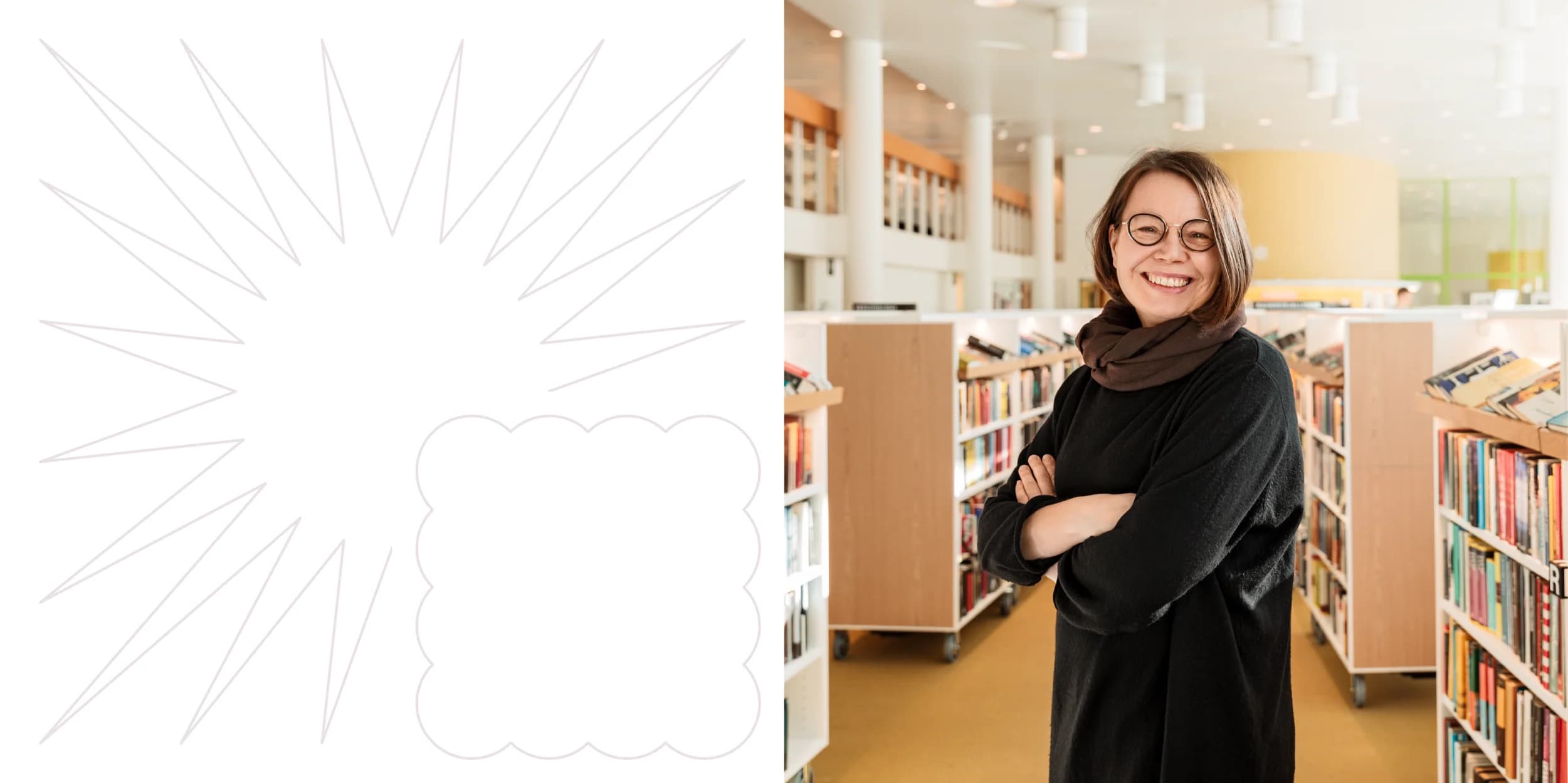 Smiling woman with crossed arms stands in a bright library. Bookshelves and a partially blurred person are visible in the background.