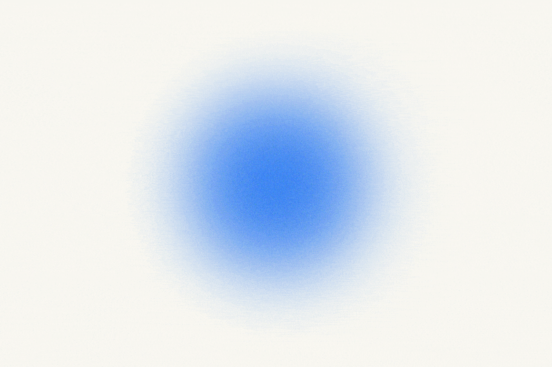 A fuzzy, light blue circle appears on a textured white background.