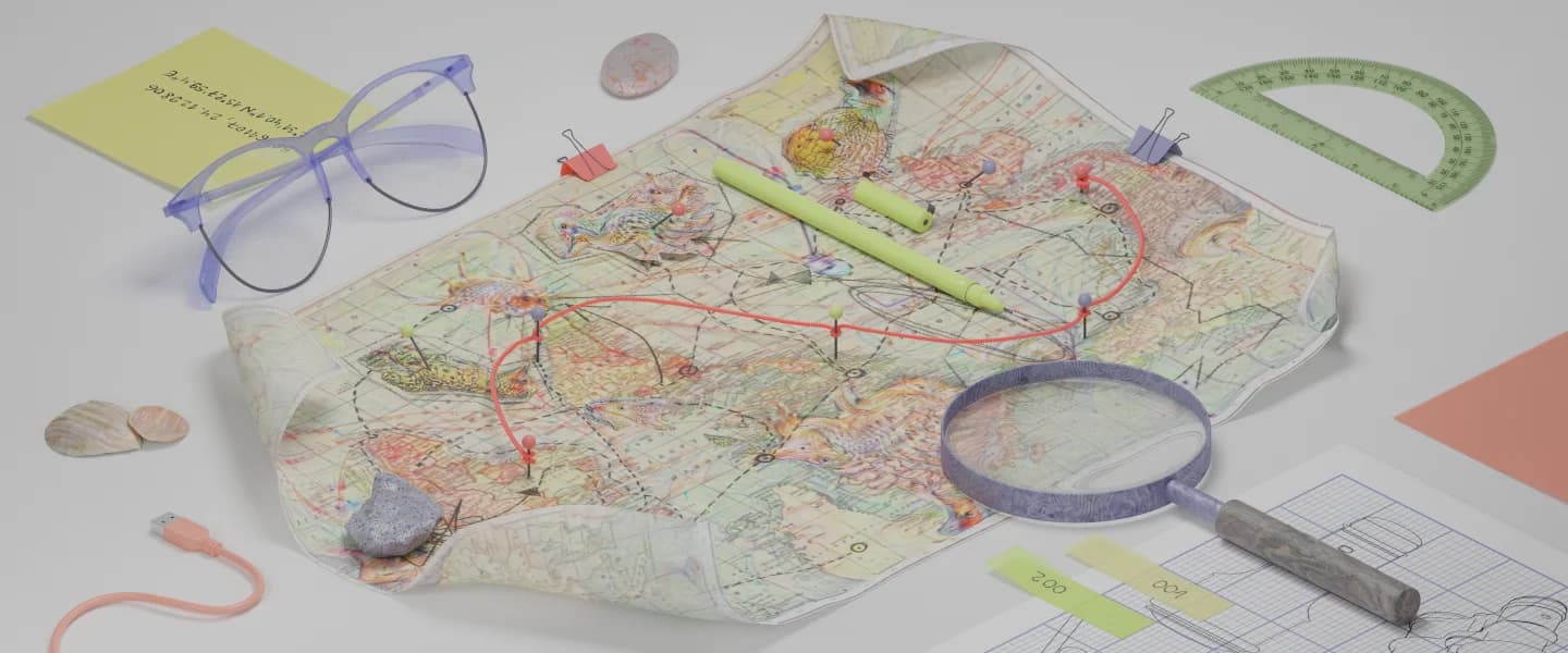 A whimsical flat lay of a map marked with a planned route.