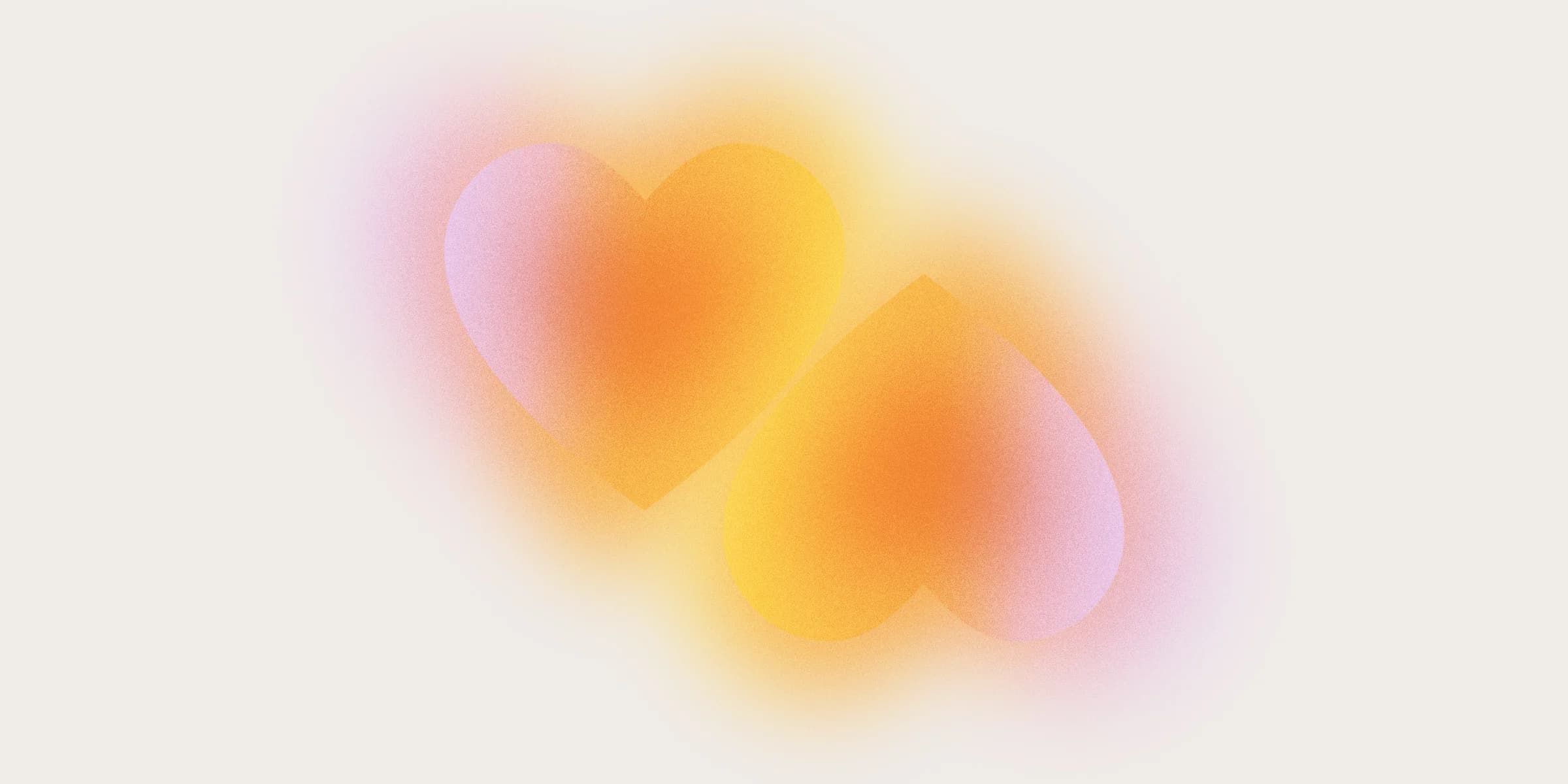 Two overlapping, gradient hearts on a soft-focus, light gray background.