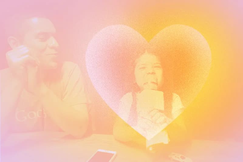 A girl sings karaoke, watched adoringly by her dad. A textured heart shape frames the girl. Warm pink and orange tones wash over the scene.