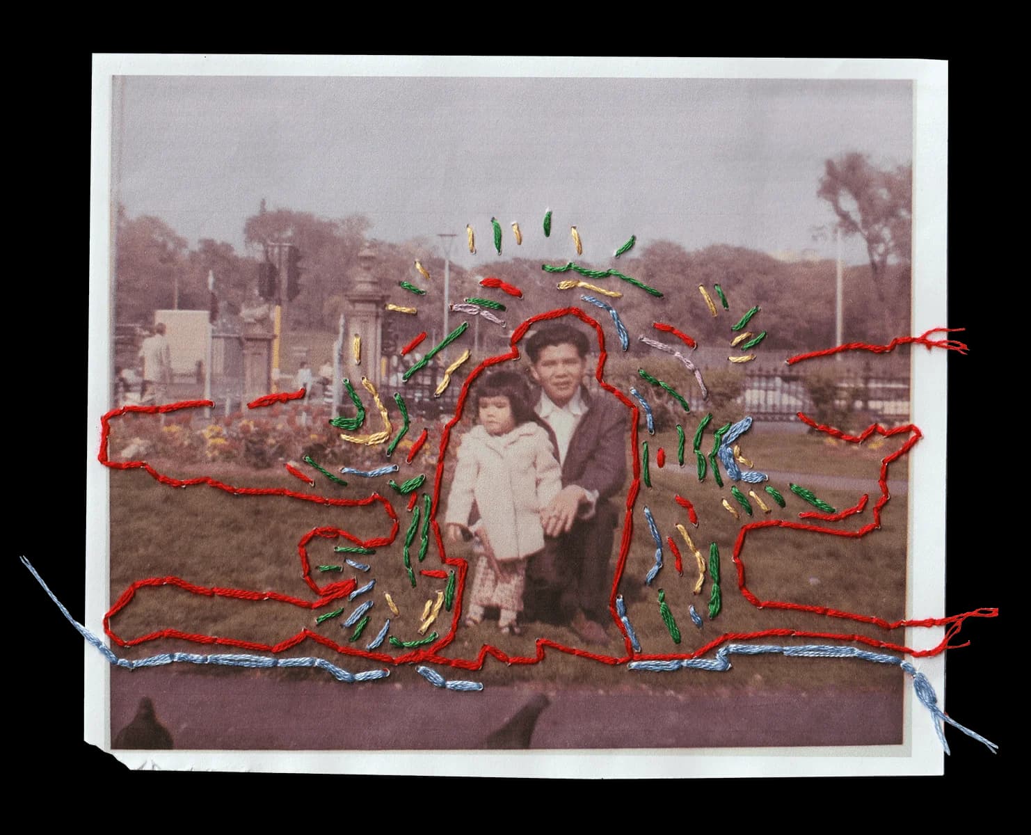 Vintage photo of a young Margaret Lee and her father. Red, green, blue, & gold thread outlines a whimsical, cloud-like shape around them.