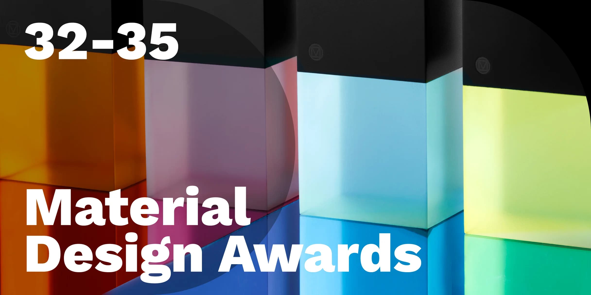 Colorful translucent blocks – Material Design Award trophies – stand in a row, casting bright light.